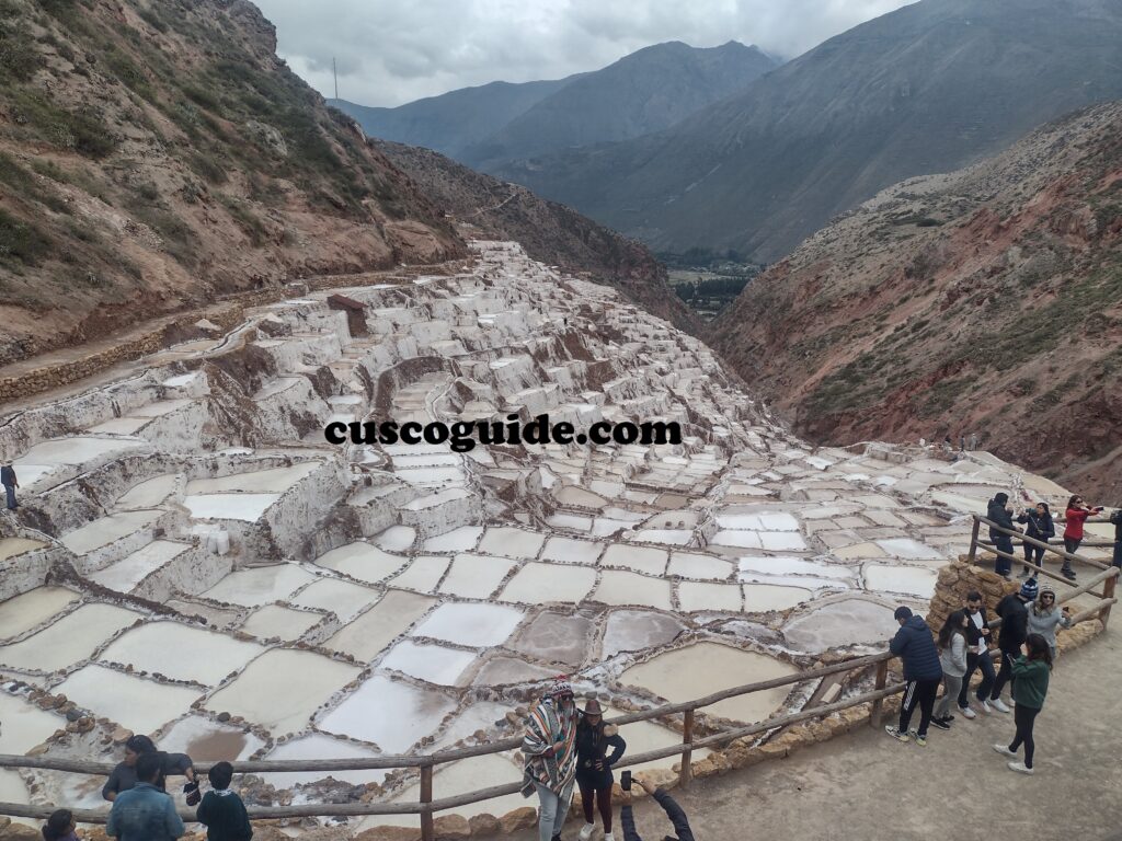 The Maras salt mines in Peru’s Sacred Valley, showcasing terraced salt evaporation ponds glistening in the sunlight.