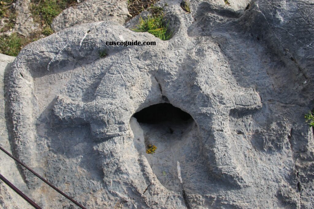 Condor-shaped stone carvings at the Moon Temple, Cusco, Peru, showcasing intricate Inca art and symbolism.